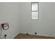 Utility area with tile floors and necessary hookups for laundry machines, providing functionality at 1108 Taylor St, Durham, NC 27701