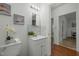 Bathroom featuring modern vanity with marble backsplash at 1108 Taylor St, Durham, NC 27701