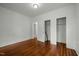 Bedroom featuring hardwood floors, white walls, and closet at 1108 Taylor St, Durham, NC 27701