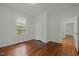 Bright bedroom featuring hardwood floors, white walls and natural light at 1108 Taylor St, Durham, NC 27701