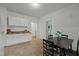 Bright dining area featuring a dining room table, tile floors and white walls at 1108 Taylor St, Durham, NC 27701