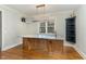 Custom bar with granite countertop and dark wood cabinetry at 113 Meadowglades Ln, Cary, NC 27518