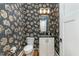 Stylish bathroom with patterned wallpaper and modern vanity at 113 Meadowglades Ln, Cary, NC 27518