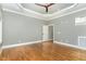 Spacious bedroom with hardwood floors and ceiling fan at 113 Meadowglades Ln, Cary, NC 27518