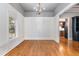 Formal dining room with hardwood floors and wainscoting at 113 Meadowglades Ln, Cary, NC 27518