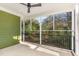 Relaxing screened porch with ceiling fan and view of backyard at 113 Meadowglades Ln, Cary, NC 27518