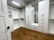 Spacious walk-in closet with built-in shelving and drawers at 113 Meadowglades Ln, Cary, NC 27518