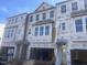 Three-story townhome under construction, showing exterior features and materials at 1204 Alston Landing Way # 07, Cary, NC 27519
