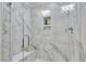 Large walk-in shower with marble tile and built-in shelving at 1204 Alston Landing Way # 07, Cary, NC 27519