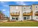 Rear view of townhouses with private decks and fenced yards at 1204 Alston Landing Way # 07, Cary, NC 27519