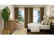 Spacious bedroom with large windows and a dresser at 1528 Goldfinch Perch Ln, Knightdale, NC 27545