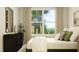 Spacious bedroom with large window and stylish dresser at 1528 Goldfinch Perch Ln, Knightdale, NC 27545