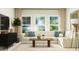 Relaxing living room featuring a sectional sofa and large windows at 1528 Goldfinch Perch Ln, Knightdale, NC 27545