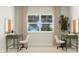 Home office with two desks, ample natural light, and built in organizers at 1528 Goldfinch Perch Ln, Knightdale, NC 27545