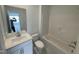 Bright bathroom features modern fixtures, a single sink, toilet, and shower/tub combination at 1528 Goldfinch Perch Ln, Knightdale, NC 27545
