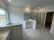 Bright bathroom features marble floors, a single sink, a luxurious tub and glass shower at 1528 Goldfinch Perch Ln, Knightdale, NC 27545