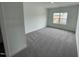 Room has neutral walls, carpeted floors, with a window overlooking construction at 1528 Goldfinch Perch Ln, Knightdale, NC 27545