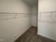 Walk-in closet with shelving and neutral walls at 1528 Goldfinch Perch Ln, Knightdale, NC 27545