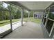 Covered and screened in porch overlooking backyard and trees at 1528 Goldfinch Perch Ln, Knightdale, NC 27545