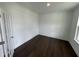 Bright room with dark wood floors, white trim, french doors and ample natural light at 1528 Goldfinch Perch Ln, Knightdale, NC 27545