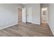 Bright bedroom with wood-look flooring and an ensuite bathroom at 1720 Ballard Dr, Raleigh, NC 27606