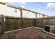 Backyard patio with brick pavers, privacy fence, and an AC unit at 3 Cheltenham Dr, Clayton, NC 27520