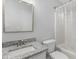 Full bathroom featuring a granite countertop, white cabinet, tub, shower, and toilet at 3 Cheltenham Dr, Clayton, NC 27520