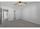 Spacious bedroom with neutral carpet and paint, a ceiling fan, and an ensuite bathroom at 3 Cheltenham Dr, Clayton, NC 27520