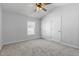 Neutral bedroom has two closets, carpet and a ceiling fan at 3 Cheltenham Dr, Clayton, NC 27520