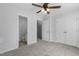 Neutral bedroom shows bathroom and closet entrances and a ceiling fan at 3 Cheltenham Dr, Clayton, NC 27520