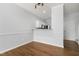 Inviting dining room with hardwood floors, neutral walls and pendant lighting at 3 Cheltenham Dr, Clayton, NC 27520