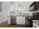 Bright kitchen featuring white cabinets, stainless steel appliances, and granite countertops at 3 Cheltenham Dr, Clayton, NC 27520