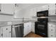 Updated kitchen features stainless steel dishwasher, granite counters, and modern appliances at 3 Cheltenham Dr, Clayton, NC 27520