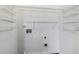 White laundry room with wire shelving, electrical outlets, and plumbing hookups at 3 Cheltenham Dr, Clayton, NC 27520