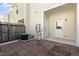 Private patio with brick pavers, an AC unit, a privacy fence and a door to the home at 3 Cheltenham Dr, Clayton, NC 27520