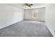 Bright bedroom with grey carpet and large window at 3113 Skybrook Ln, Durham, NC 27703