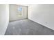 Bedroom featuring grey carpet and a window at 3113 Skybrook Ln, Durham, NC 27703