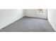 Bedroom with grey carpet and window at 3113 Skybrook Ln, Durham, NC 27703