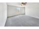 Bright bedroom featuring gray carpeting and a large window at 3113 Skybrook Ln, Durham, NC 27703