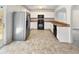 Kitchen with white cabinets, stainless steel appliances, and tile flooring at 3113 Skybrook Ln, Durham, NC 27703