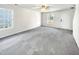 Spacious living room with gray carpeting and neutral walls at 3113 Skybrook Ln, Durham, NC 27703