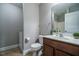 Small bathroom with toilet, sink, and shower at 332 Dove Cottage Ln, Cary, NC 27519