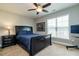 Bright bedroom featuring a double bed and large window at 332 Dove Cottage Ln, Cary, NC 27519