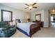 Spacious bedroom with a comfortable bed and ceiling fan at 332 Dove Cottage Ln, Cary, NC 27519