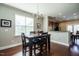 Dining area with table and chairs, open to kitchen at 332 Dove Cottage Ln, Cary, NC 27519