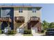 Rear view of townhouses with private decks and garages at 332 Dove Cottage Ln, Cary, NC 27519