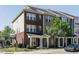 Brick townhome with a front porch and landscaping at 332 Dove Cottage Ln, Cary, NC 27519
