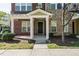 Townhome's front entrance with a covered porch at 332 Dove Cottage Ln, Cary, NC 27519