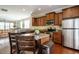 Open kitchen with granite island and breakfast bar at 332 Dove Cottage Ln, Cary, NC 27519