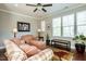 Living room with plaid sofa and arm chair, ceiling fan at 332 Dove Cottage Ln, Cary, NC 27519